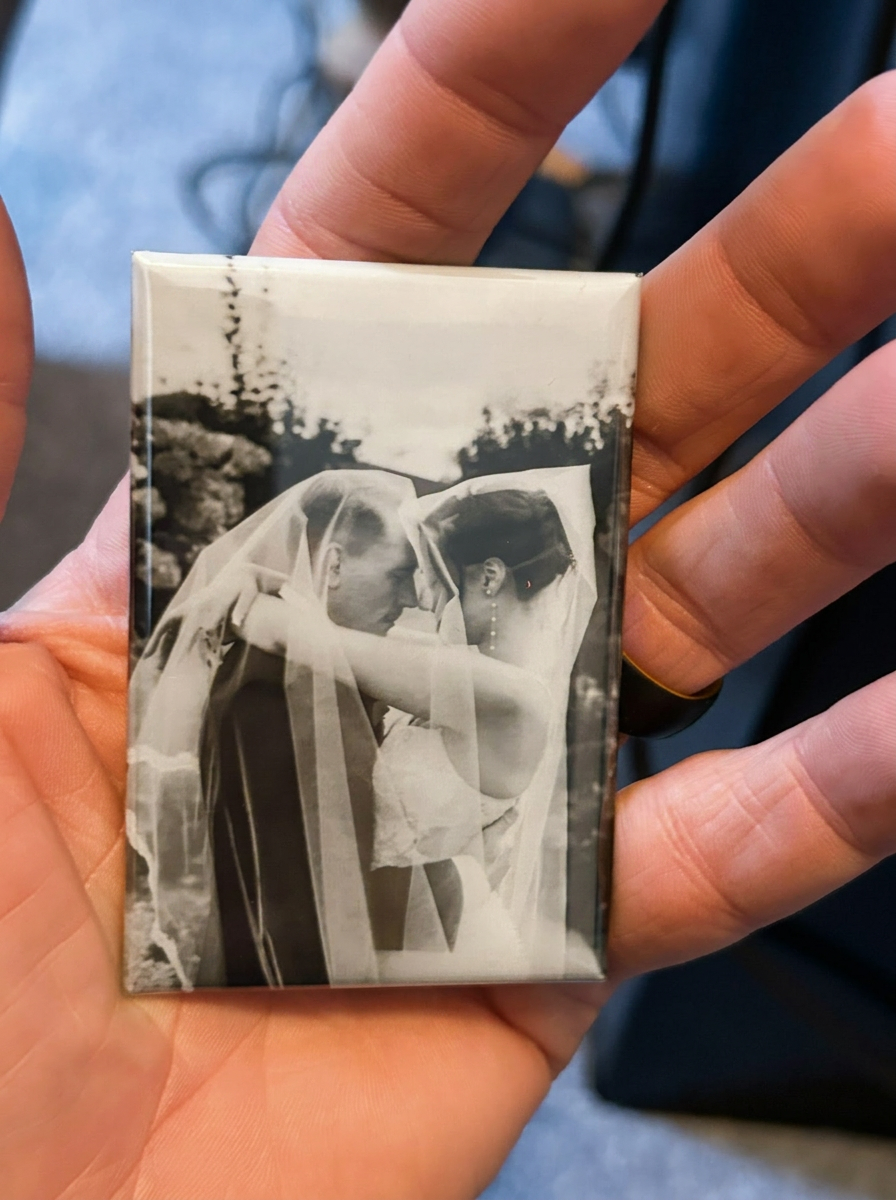 Wedding photo magnet held in hand